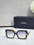 Chanel square sunglasses with deep plum frames and gold-tone hinges