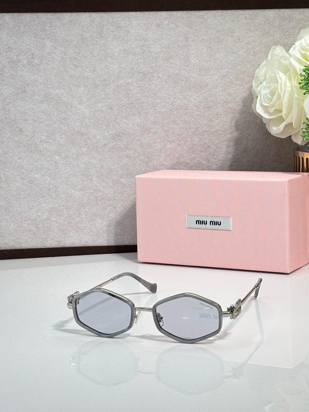 MiuMiu silver octagonal sunglasses with light lenses and metal arms