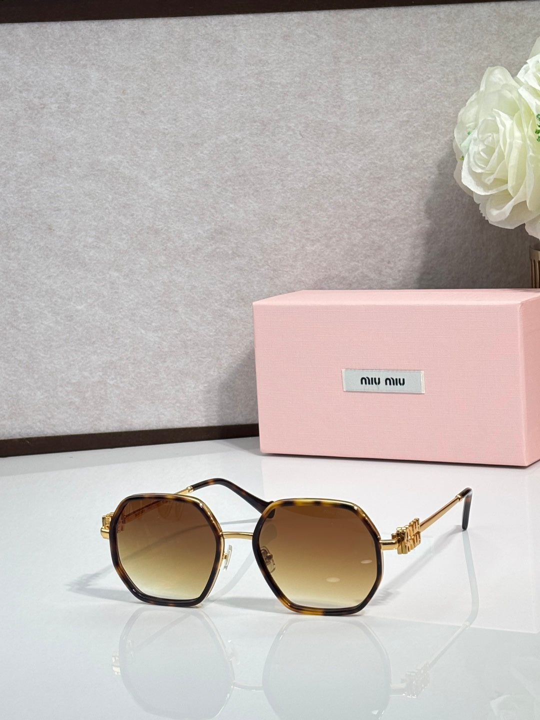 Square sunglasses with tortoiseshell-style frame, tinted lenses, gold-toned temples