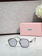 Round-edged square sunglasses with gray frame and dark lenses, metal temple hardware