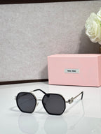 Square sunglasses with black frame and dark lenses, metallic detail on temples