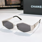 Hexagon sunglasses with silver frames and dark lenses, black temple arms