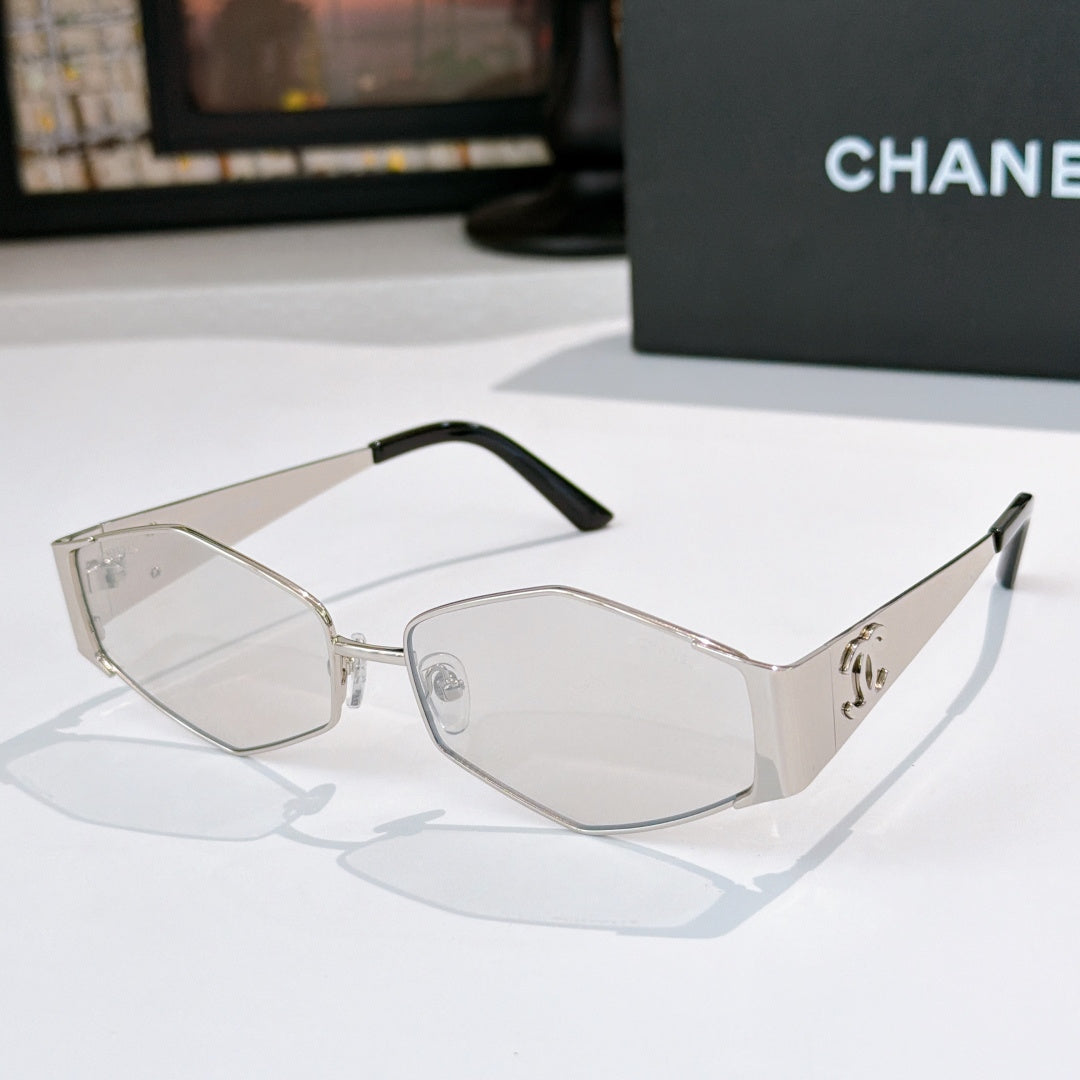Hexagon sunglasses with clear-silver frames and dark lenses, detailed temples