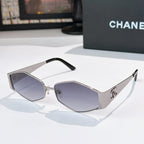 Chanel sunglasses with silver frames and dark purple lenses, black temple tips