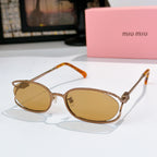 MiuMiu sunglasses with gold-tone oval frames and amber lenses, orange-tinted temple arms