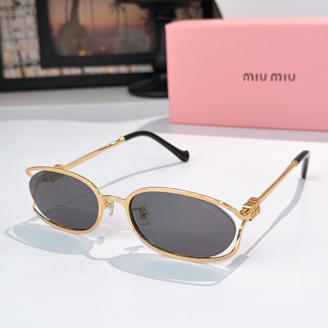 MiuMiu sunglasses with gold-tone oval frames and dark gray lenses, black temple arms