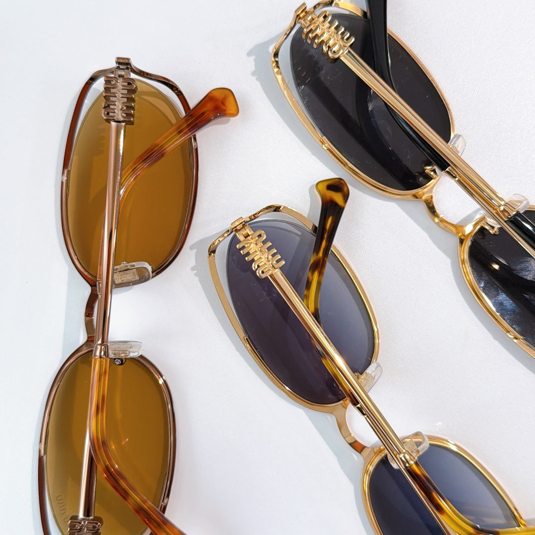 MiuMiu sunglasses set with gold-tone frames, amber and dark lenses, multiple pairs