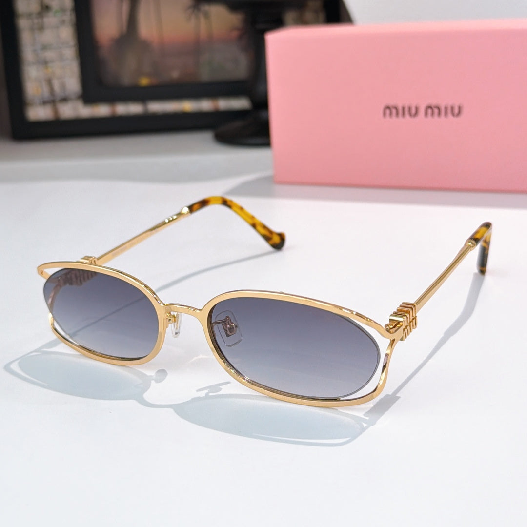 MiuMiu sunglasses with gold-tone oval frames and dark gray lenses, gold temple arms