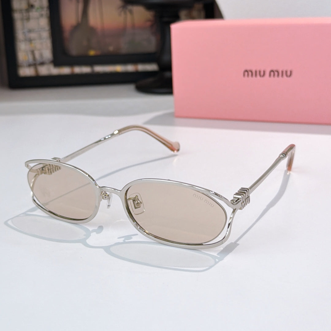MiuMiu sunglasses with silver-tone oval frames and light tan lenses, metal temple arms