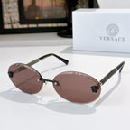 Round sunglasses with dark lenses, gold frame, and textured arms with decorative studs