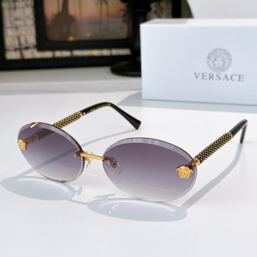 Round sunglasses with purple lenses, gold bridge, and textured arms with gold accents
