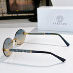 Round sunglasses with blue-tinted lenses, gold frame, and textured temples in dark blue