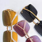 Gold-trim sunglasses with assorted gradient lenses, shown in close-up