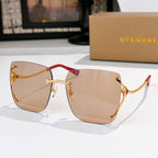 Light brown gradient sunglasses with gold-tone frames and red temple accents