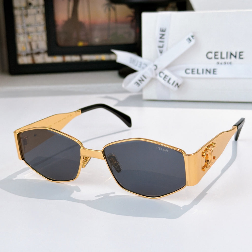 Celine gold sunglasses with dark blue lenses and sculpted corner detailing