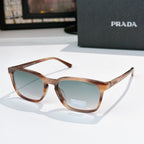 Prada sunglasses with brown frame and blue-green tinted lenses