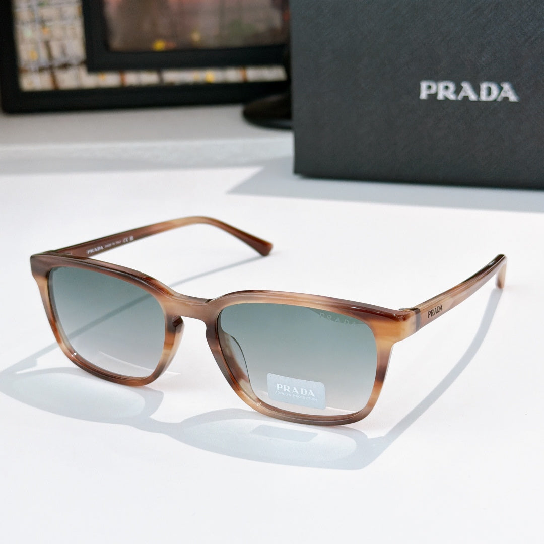 Prada sunglasses with brown frame and blue-green tinted lenses