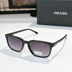 Prada sunglasses with black frame and purple-tinted lenses