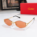 Cartier sunglasses with gold metal frame, orange tinted lenses, black temple tips