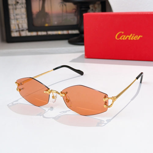 Cartier sunglasses with gold metal frame, orange tinted lenses, black temple tips