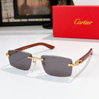 Cartier sunglasses with gray lenses and brown temple arms, gold-tone metal frame