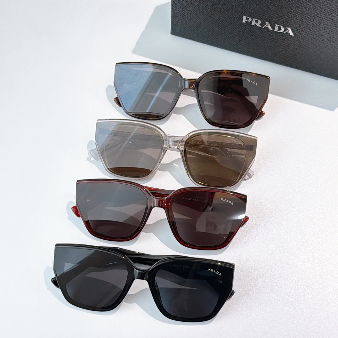 Prada sunglasses assortment with mixed frames and tinted lenses, multiple pairs