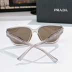 Prada sunglasses front view with clear frames and taupe tinted lenses
