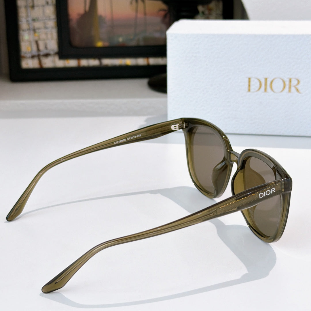 Dior cat-eye sunglasses with olive frame and brown tinted lenses, side profile