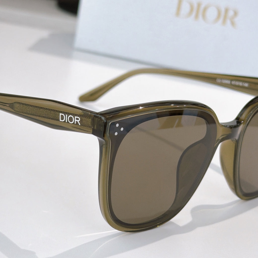 Dior sunglasses side view with olive frame and brown tinted lenses
