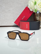 Prada sunglasses with dark frames and brown-tinted lenses
