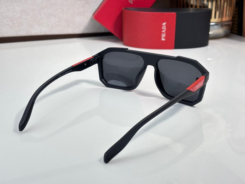 Prada sunglasses side profile with black frames and dark lenses