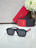 Prada sunglasses with black oversized square lenses and dark tint