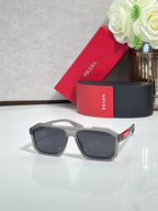 Prada sunglasses with light gray frames and dark rectangular lenses