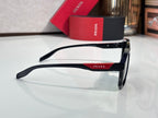 Slim black sunglasses with dark lenses and Prada logo on temple, side view