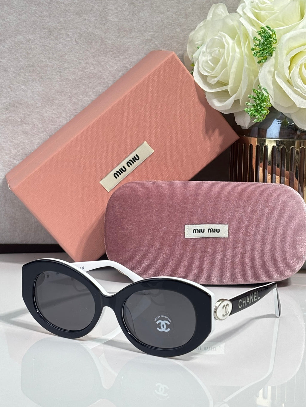 Designer round sunglasses with light frames and dark lenses