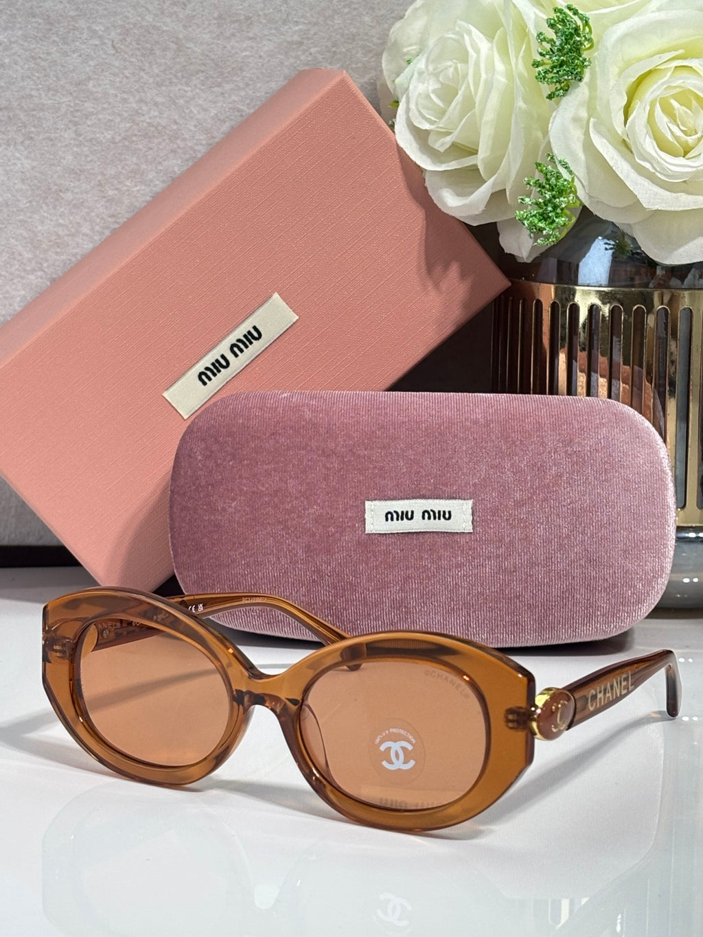 Round sunglasses with brown tortoiseshell frame and light tinted lenses