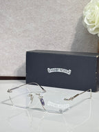 Metal eyeglasses with clear lenses, dark temple arms, and engraved side logo