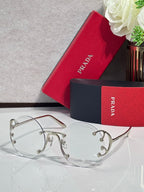 Prada round sunglasses with clear tinted lenses and silver-tone metal frame