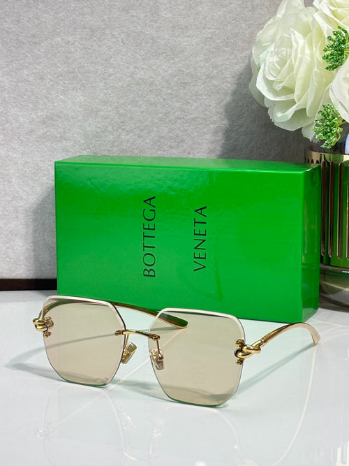 Bottega Veneta sunglasses with gold-tone frame and light brown tinted lenses