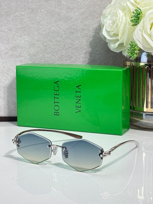 Metal sunglasses with blue-tinted lenses and slim silver frames