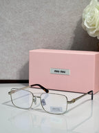 Gold-tone rectangular eyeglasses with clear lenses and black temple tips