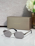 Hexagon sunglasses with gray lenses, silver-tone frame and dark blue temples