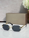Hexagon sunglasses with dark blue lenses, gold-tone metal frame and arms