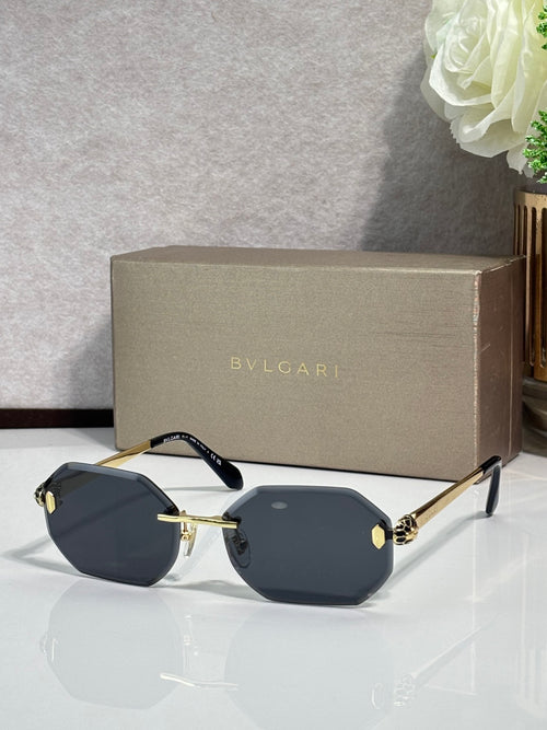Hexagon sunglasses with dark blue lenses, gold-tone metal frame and arms