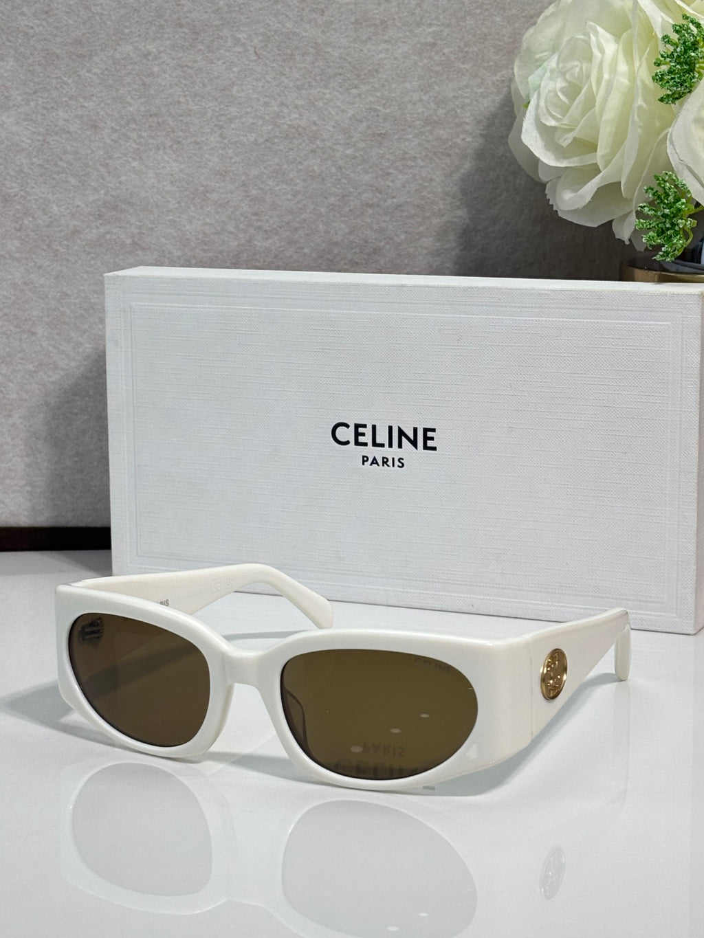 Celine sunglasses, white frame with dark brown oval lenses and gold temple logo
