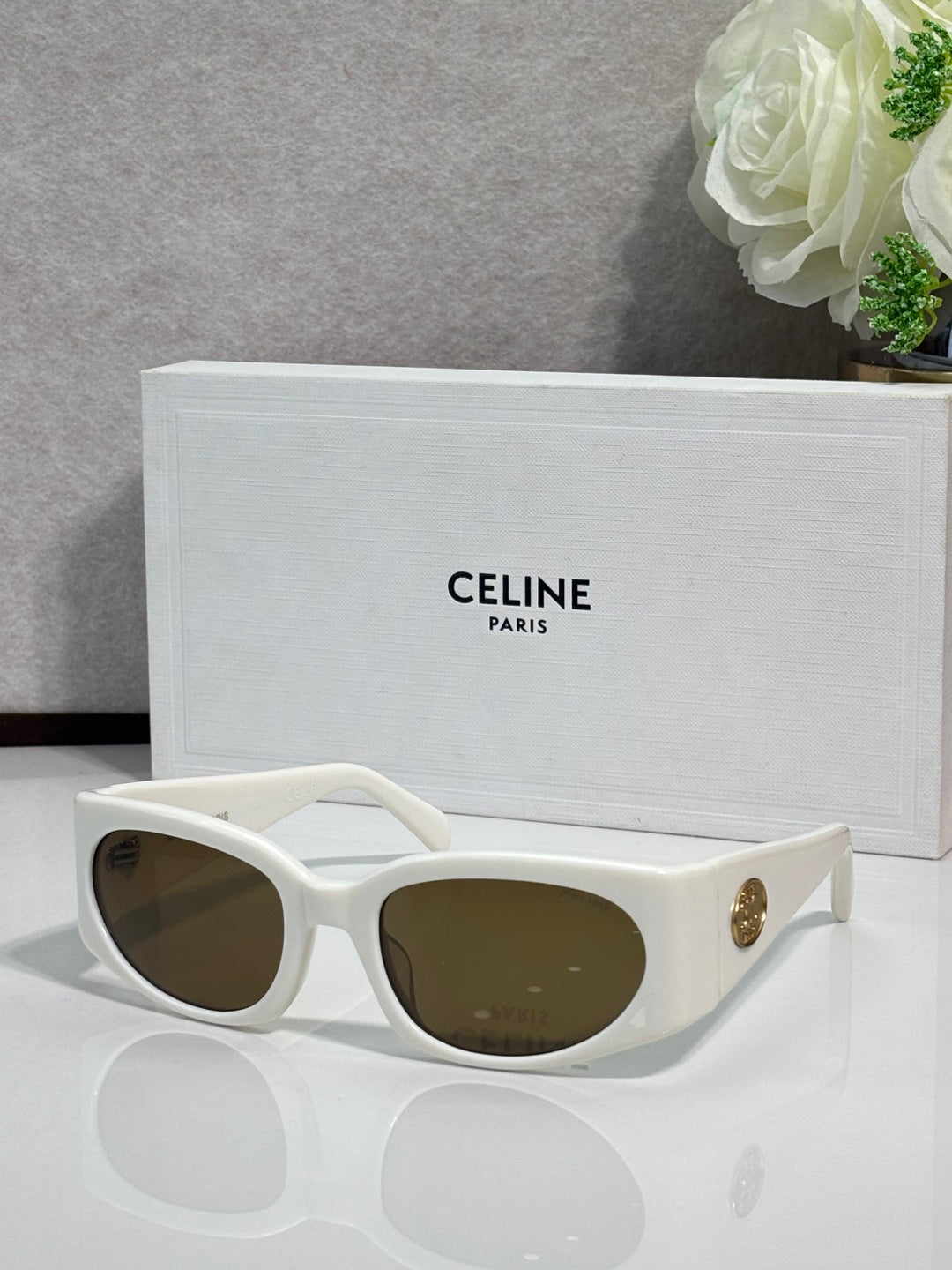 Celine sunglasses, white frame with dark brown oval lenses and gold temple logo