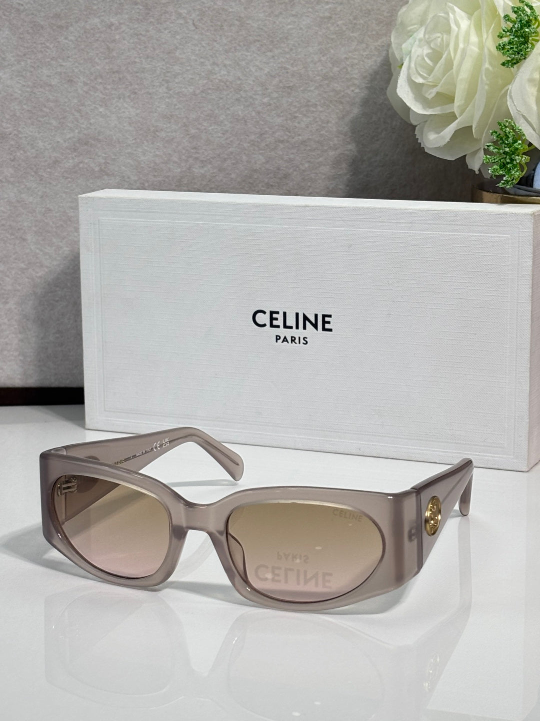 Celine sunglasses, taupe frame with tan oval lenses and gold side logo