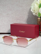 Cartier sunglasses with gold-tone frame and pink gradient lenses