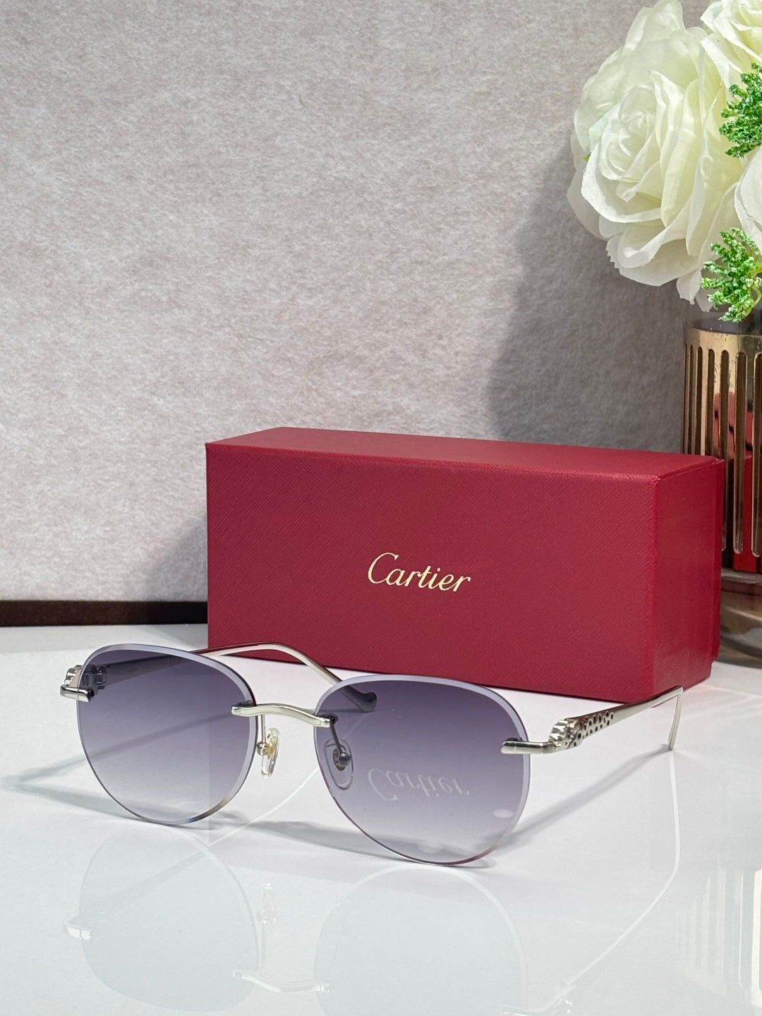 Cartier sunglasses with silver-tone frame and purple gradient lenses
