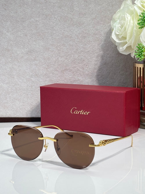 Cartier sunglasses with gold-tone frame and brown gradient lenses